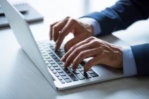 depositphotos 150403574 stock photo businessman working with laptop