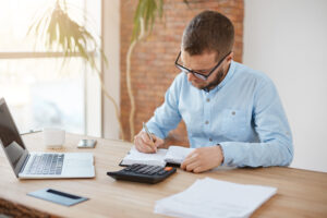 young caucasian male manager glasses sitting company office