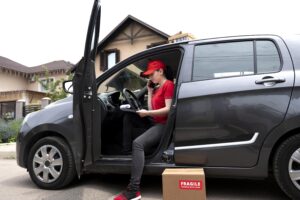 full shot delivery woman car 1